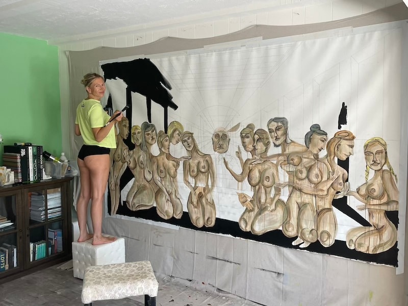 Marina Orlova painting large nude figurative mural in studio