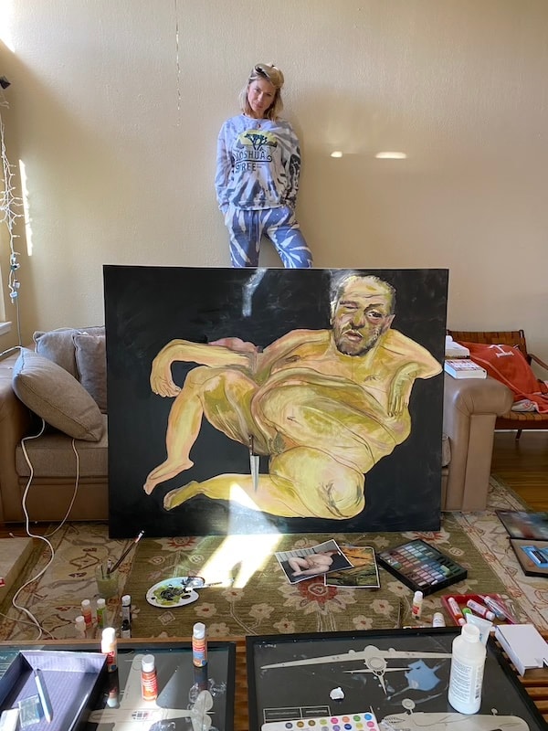 Marina Orlova posing behind large figurative painting in studio