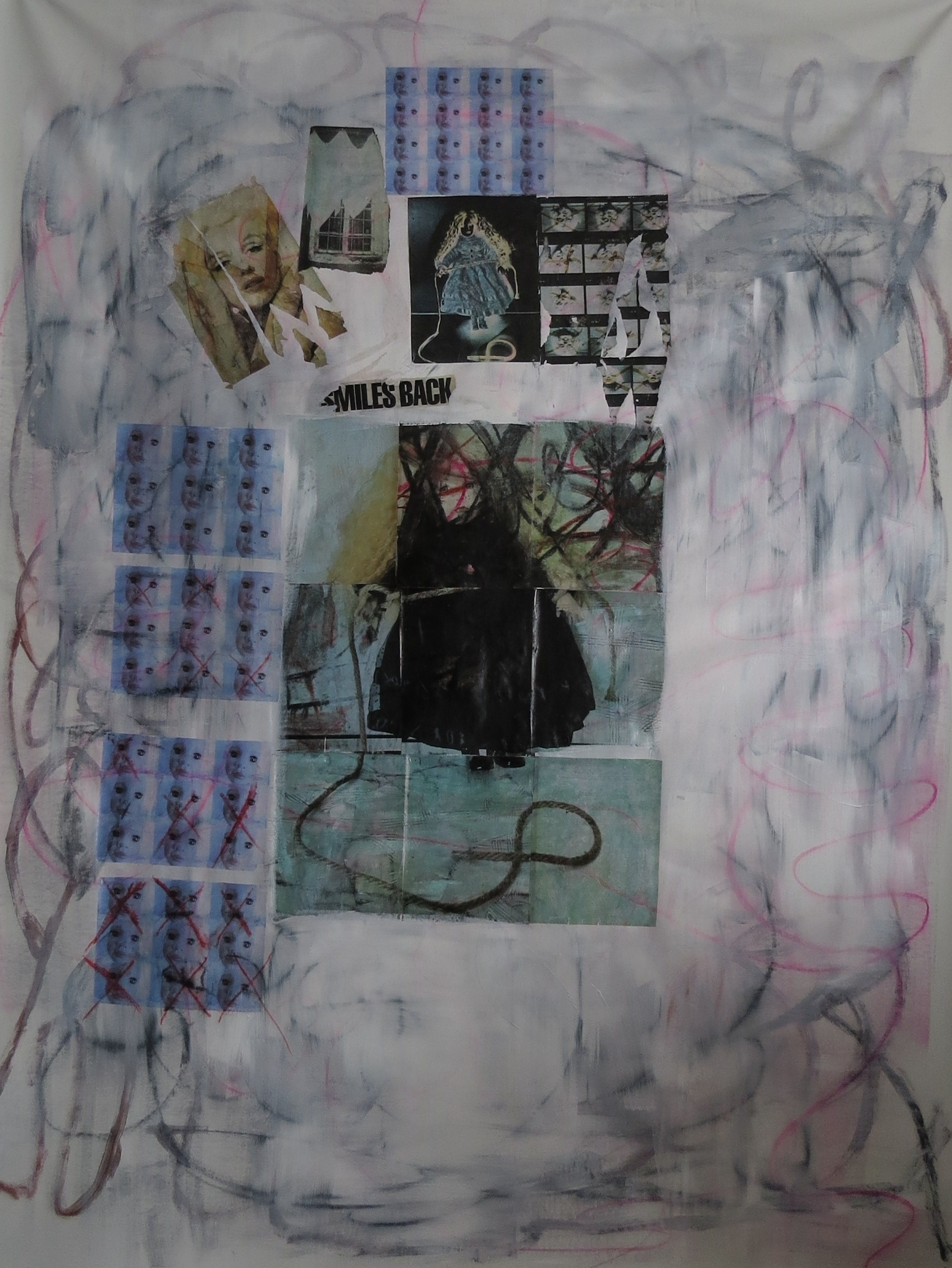 Marina Orlova with mixed media collage artwork in studio