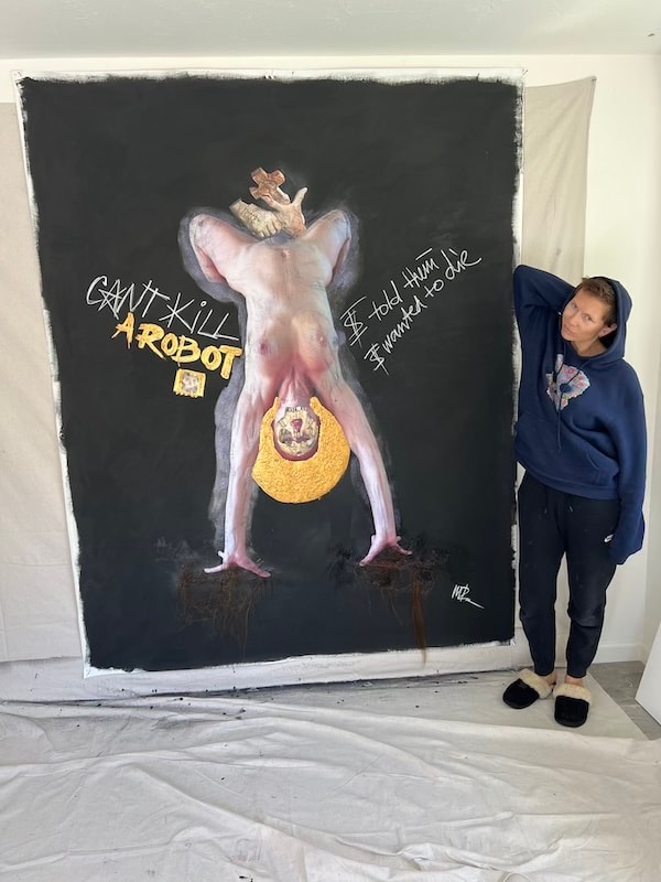 Marina Orlova beside large Can't Kill a Robot painting in studio