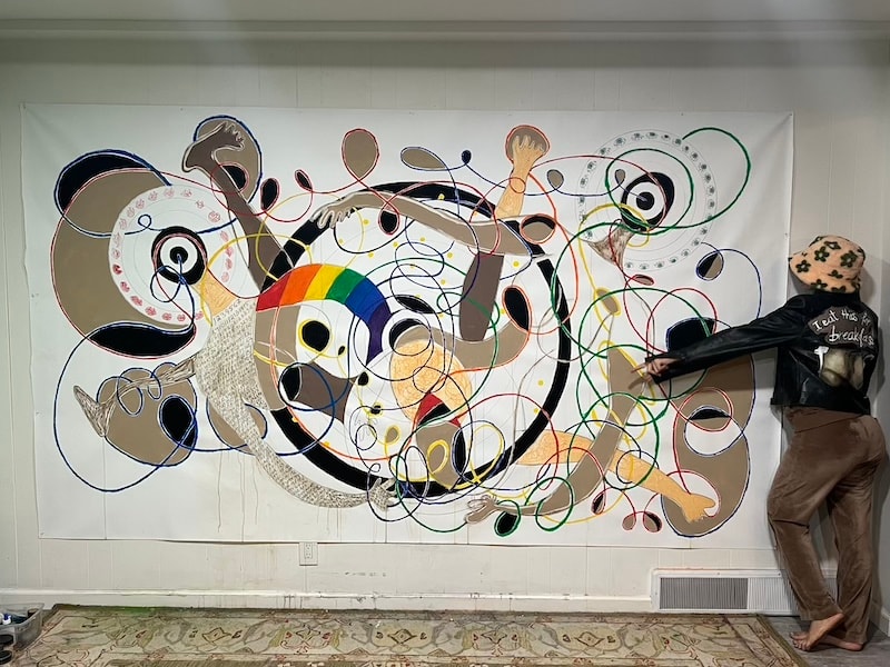 Marina Orlova creating abstract mural wall art in studio